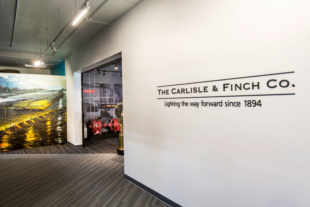 Wall displaying the Carlisle and Finch Co. logo