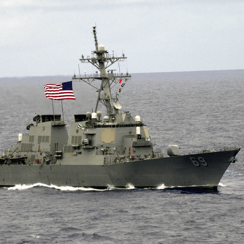 Military ship flying American flag